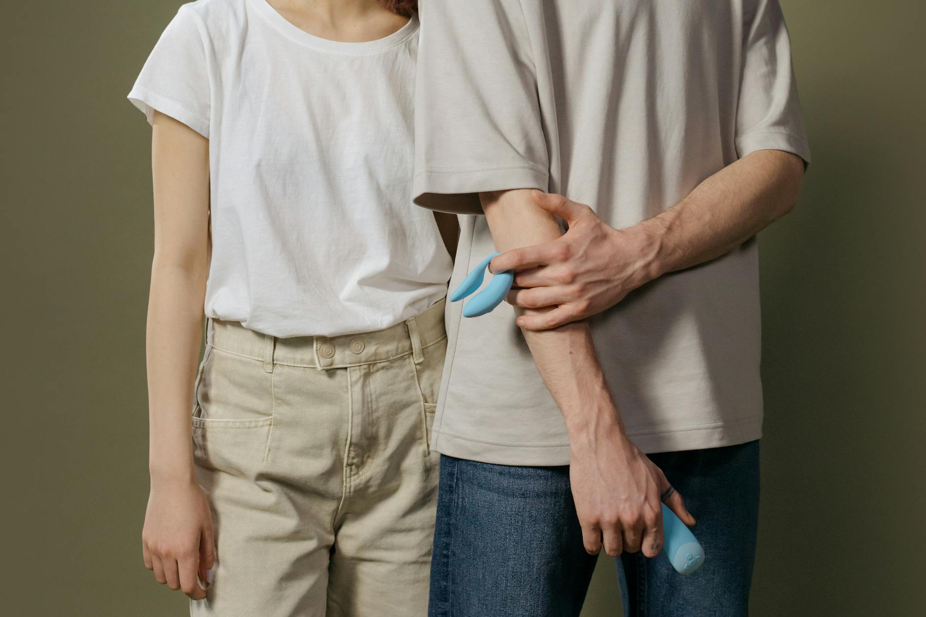 A couple sitting close together, exploring intimacy during difficult times